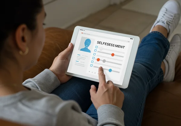 Person completing an online mental health self-assessment.